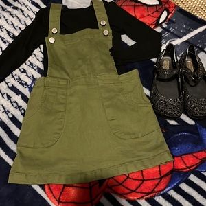 Copper Key jumper skirt with long sleeve black tee to match. Shoes not avail